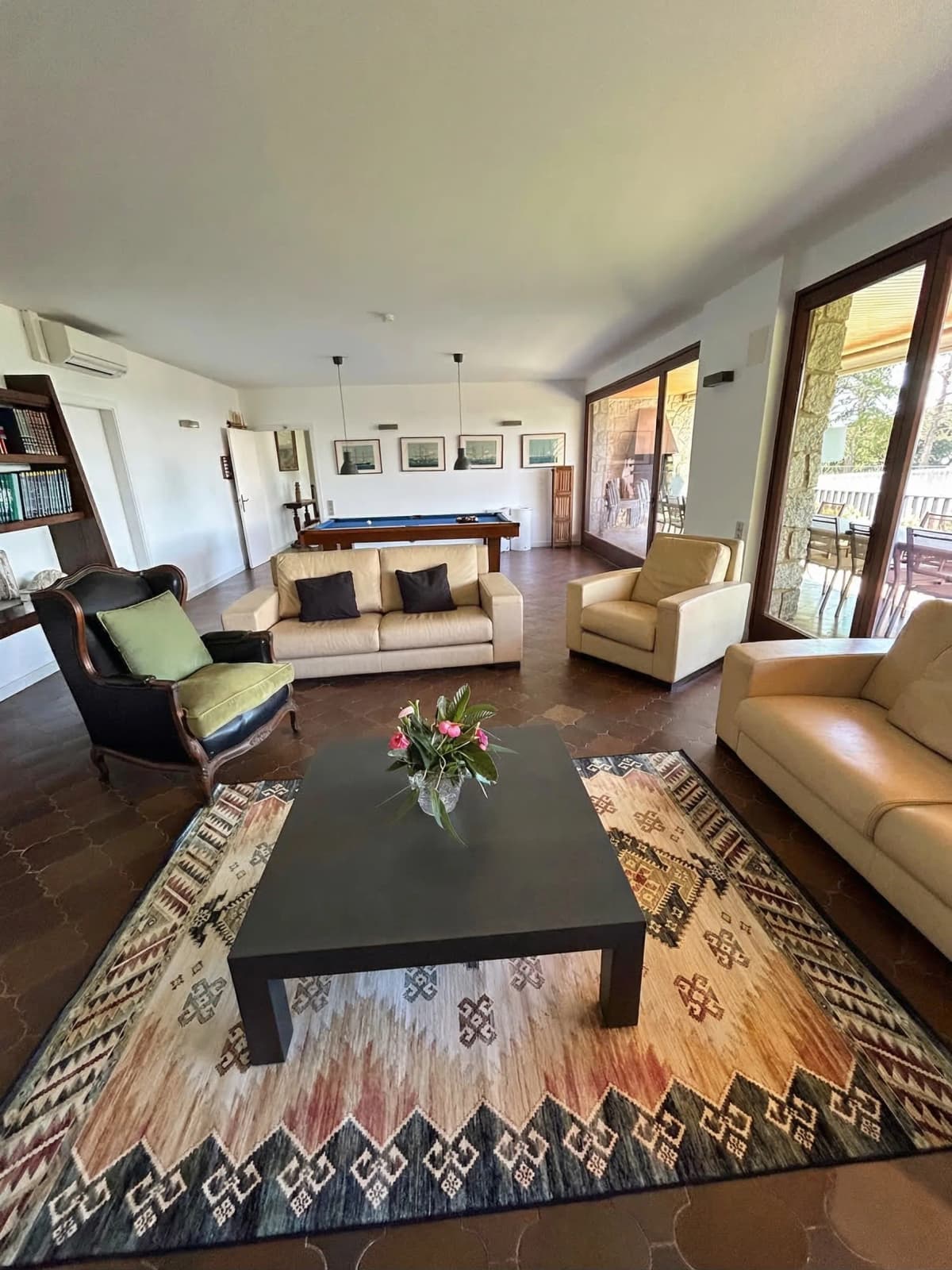 Spacious living room with billiard table